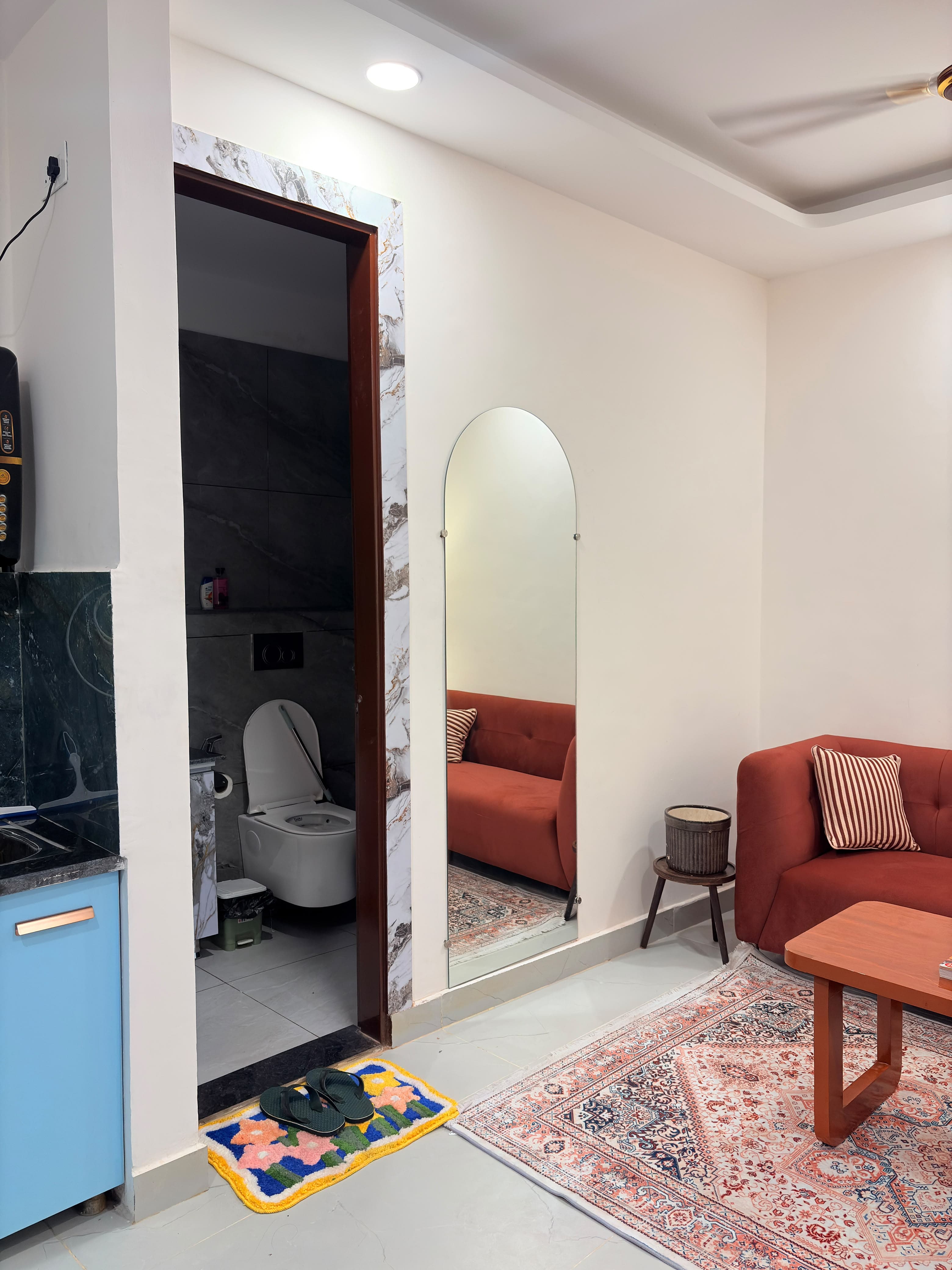 Tapovan Nest living area and bathroom entrance